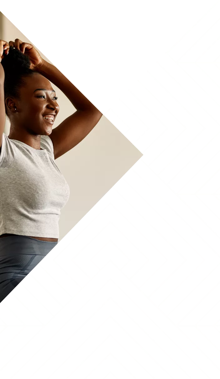 Smiling woman stretching, overlaid with black and white geometric patterns in a modern design.